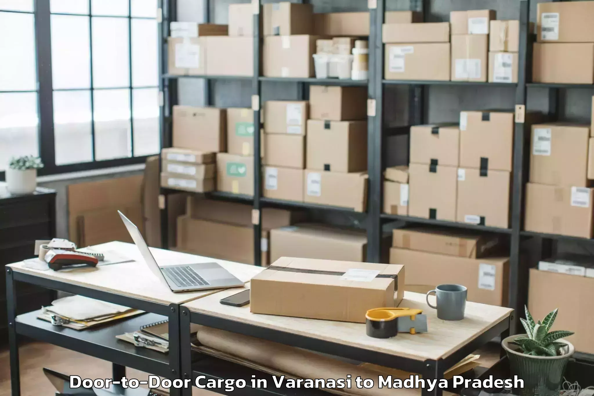 Book Varanasi to Manawar Door To Door Cargo Online